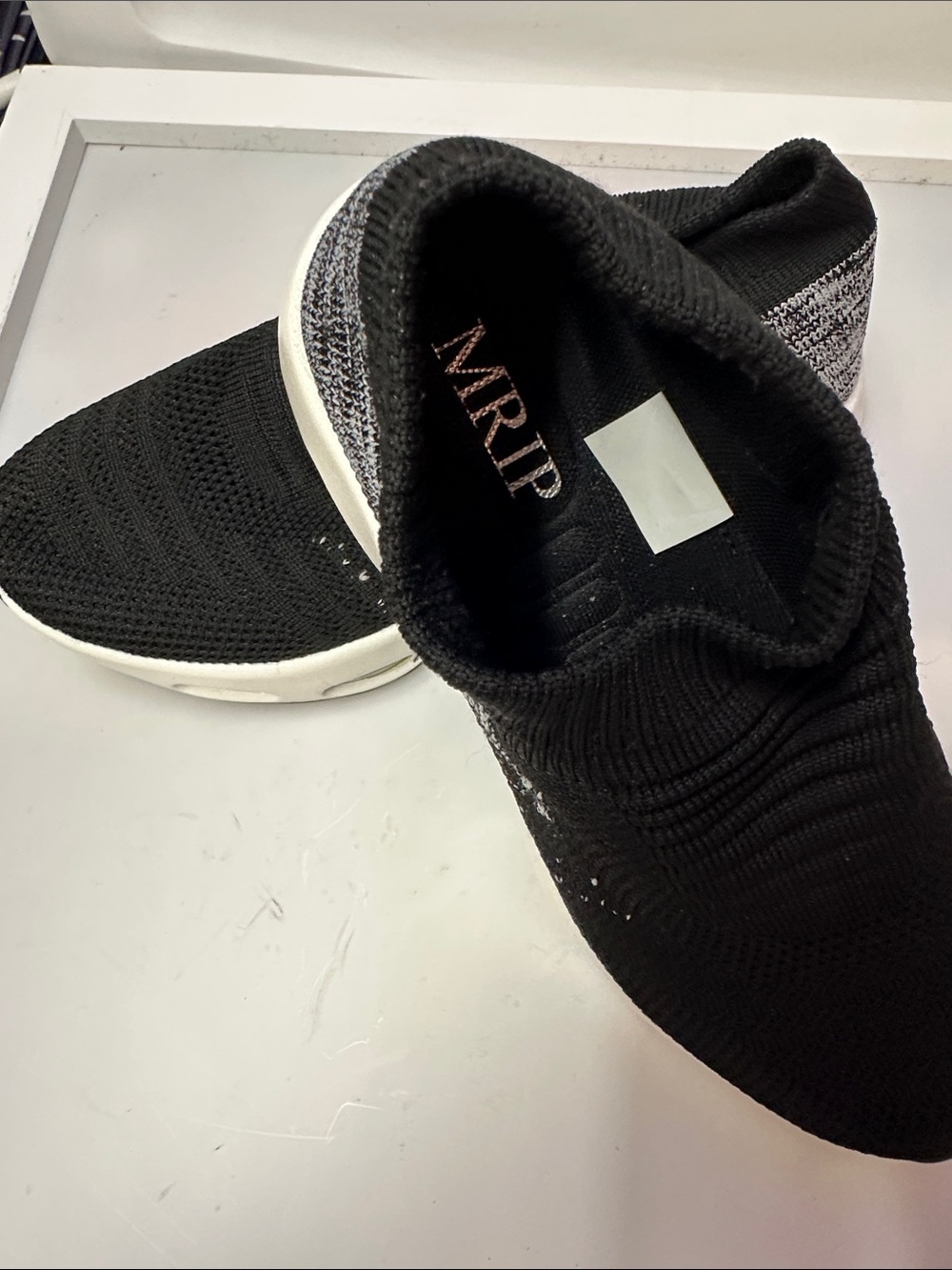 Women’s Slip-On Knit Sneakers in Black and White
